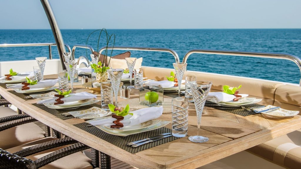 Table set for dinner on a yacht | Is A Career In Yachting Industry Good For Me